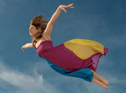 woman-flying-through-sky-side-view-1761303